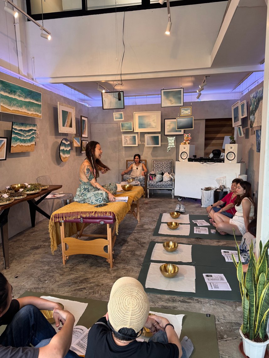 Participants learning in a herbal compress and massage workshop